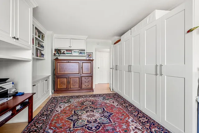 a bathroom with a shower sink mirror and toilet