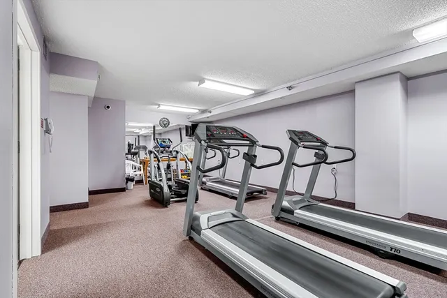a room with gym equipment and a large window