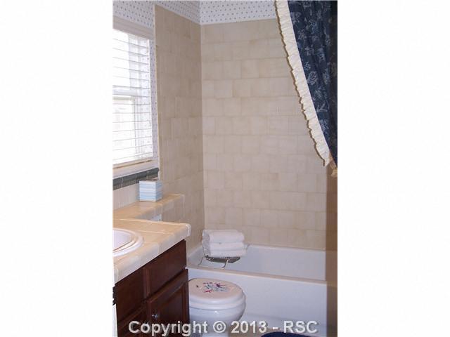 812 Spectrum Loop Colorado Springs, CO 80921 - Photo 15 of 17 In-suite bathroom off of bedroom #2. Additional bedrooms include a Jack-n-Jill bath.