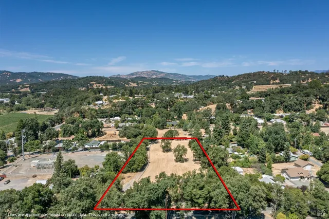 an aerial view of residential house and outdoor space