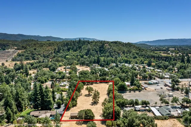 an aerial view of residential houses and outdoor space