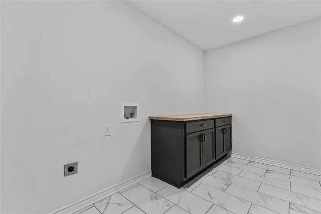 a utility room with cabinets