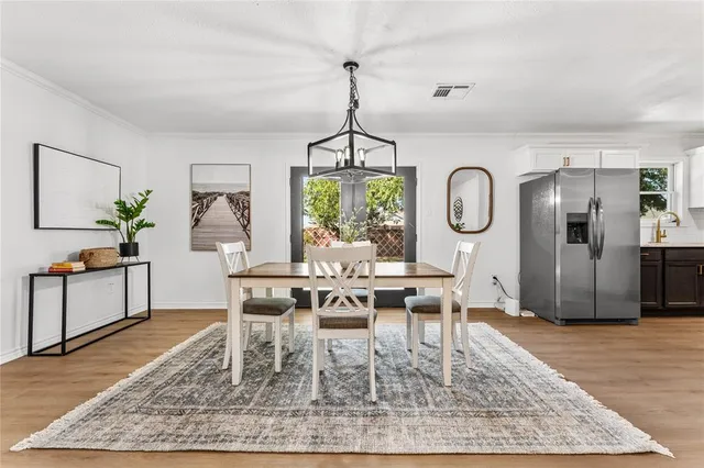 a view of a dining room and wooden floor