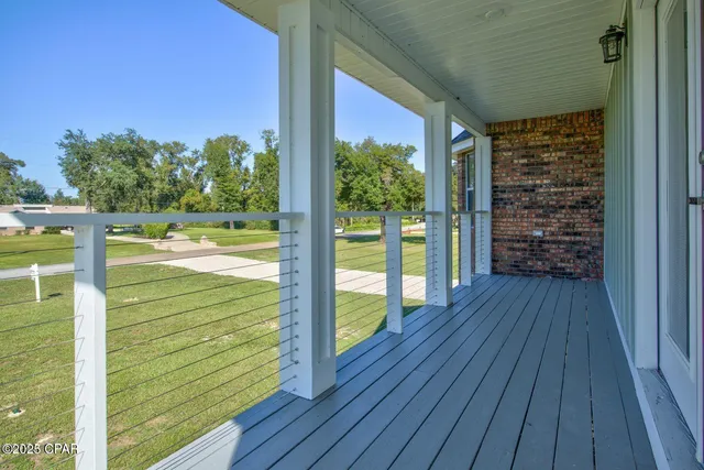 a view of balcony with wooden floor