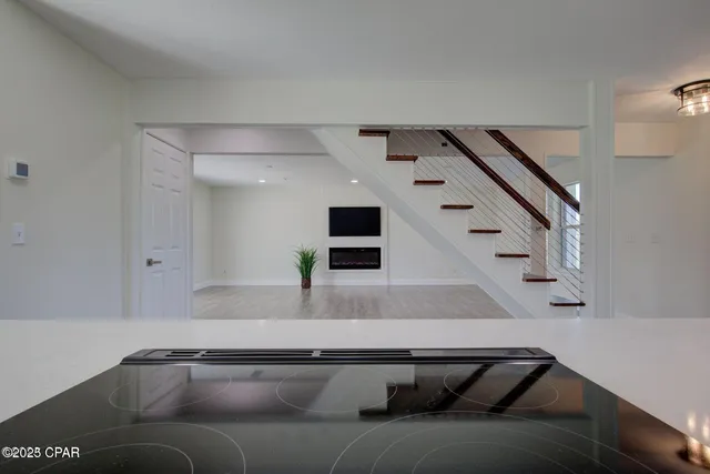 a living room with furniture and stairs