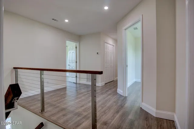 a view of entryway with wooden floor