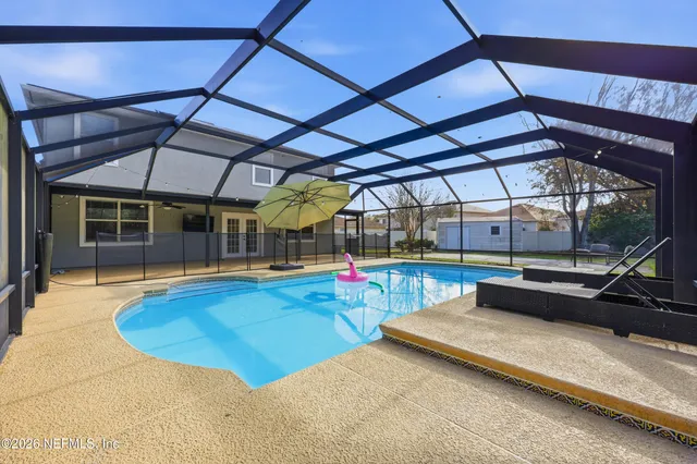 a view of a swimming pool with a patio