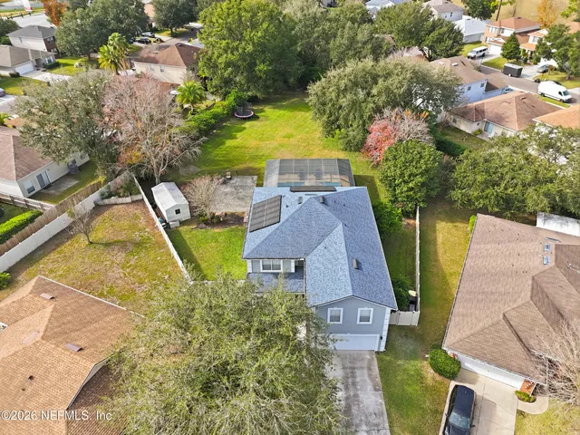 an aerial view of a house with swimming pool