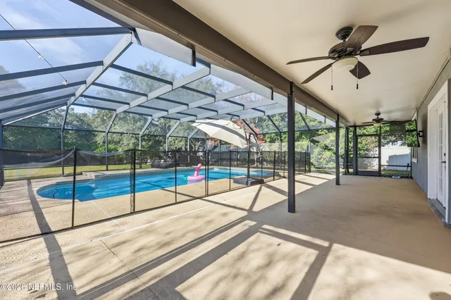 a view of a swimming pool with a porch