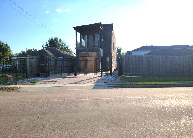 a view of backyard with a tub and a potted plant