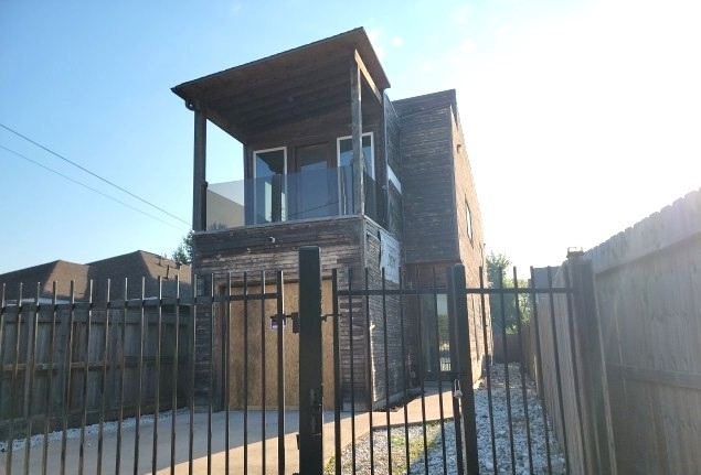 8136 North Main Street Houston, TX 77022 - Photo 2 of 20 a view of a brick house that has large windows