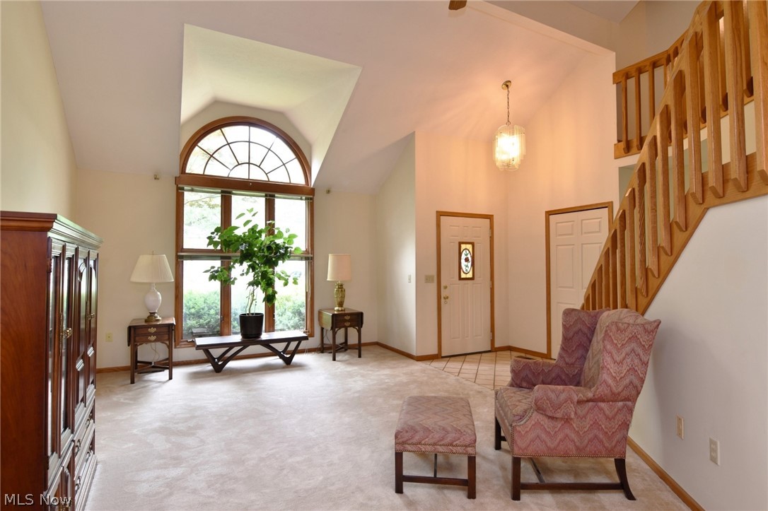 7655 Bellflower Road Mentor, OH 44060 - Photo 4 of 28 Living area with carpet floors and high vaulted ceiling