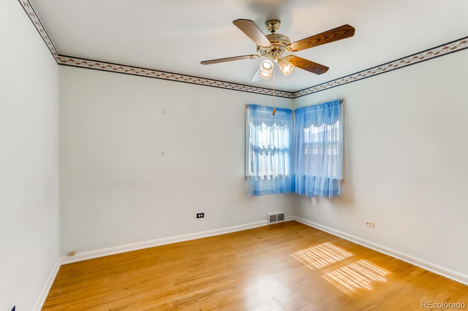 440 South Raleigh Street Denver, CO 80219 - Photo 12 of 29 a view of room with window and ceiling fan