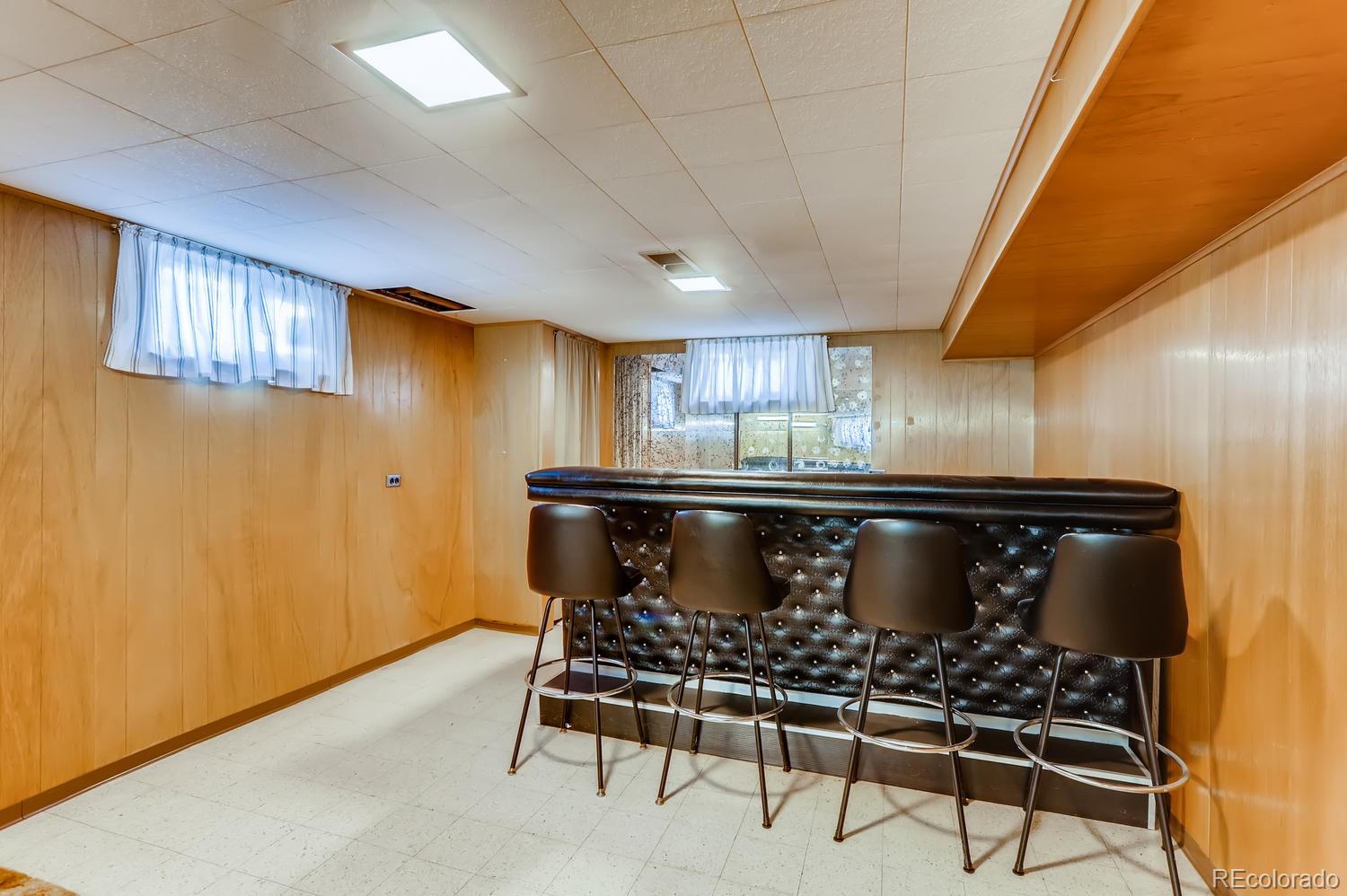 440 South Raleigh Street Denver, CO 80219 - Photo 15 of 29 a kitchen with a table and chairs in it