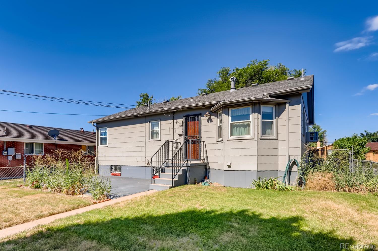 440 South Raleigh Street Denver, CO 80219 - Photo 22 of 29 a view of a house with a yard