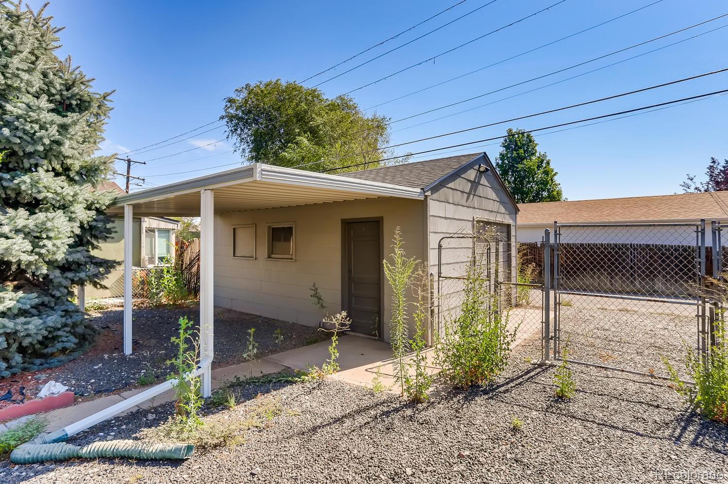 440 South Raleigh Street Denver, CO 80219 - Photo 25 of 29 a front view of a house with garden