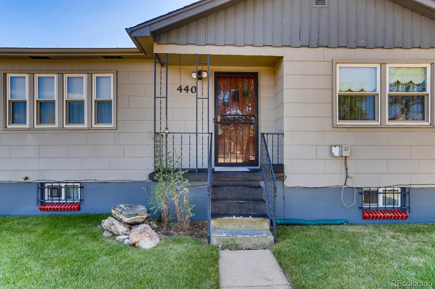 440 South Raleigh Street Denver, CO 80219 - Photo 26 of 29 a front view of a house with garden