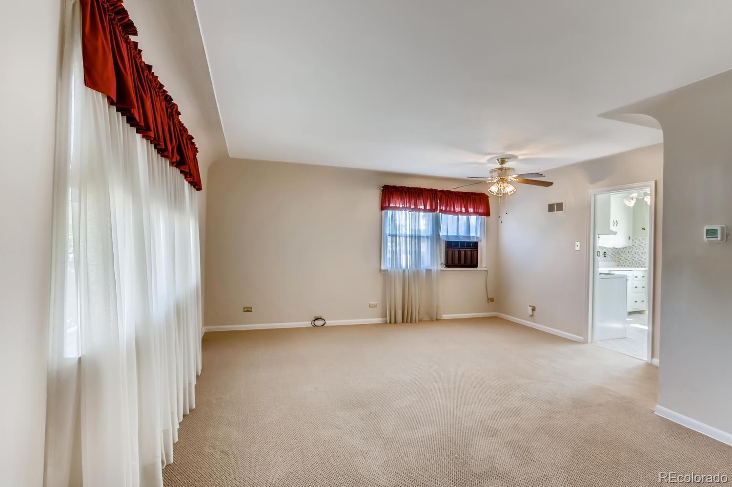 440 South Raleigh Street Denver, CO 80219 - Photo 3 of 29 a view of empty room with wooden floor