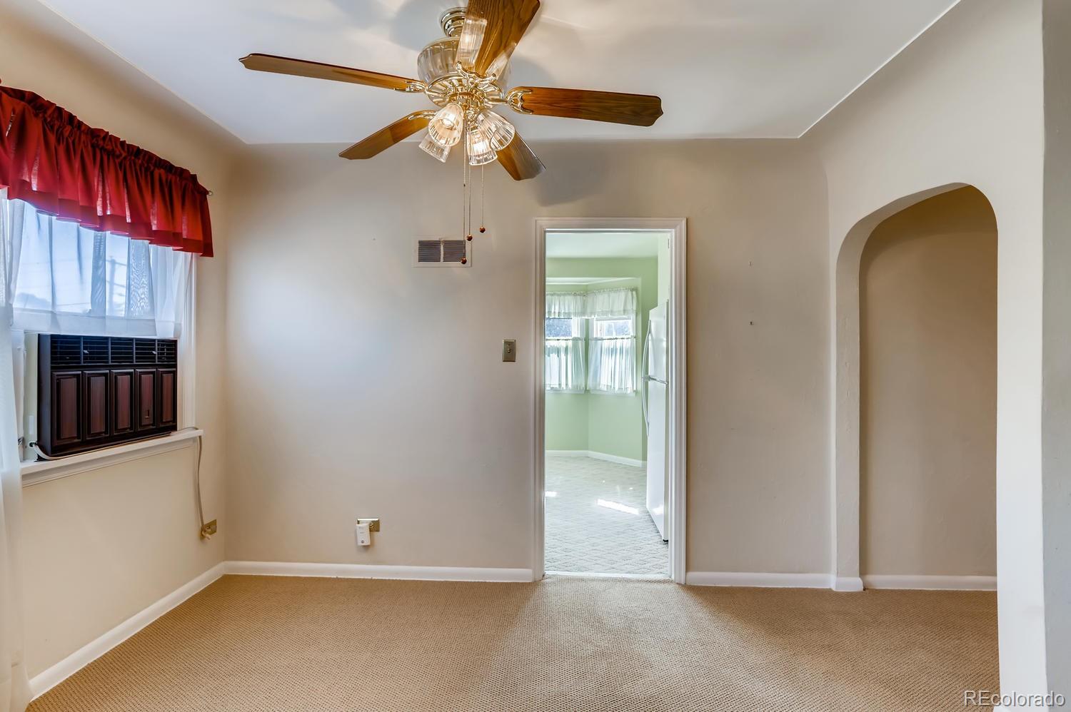 440 South Raleigh Street Denver, CO 80219 - Photo 4 of 29 an empty room with windows