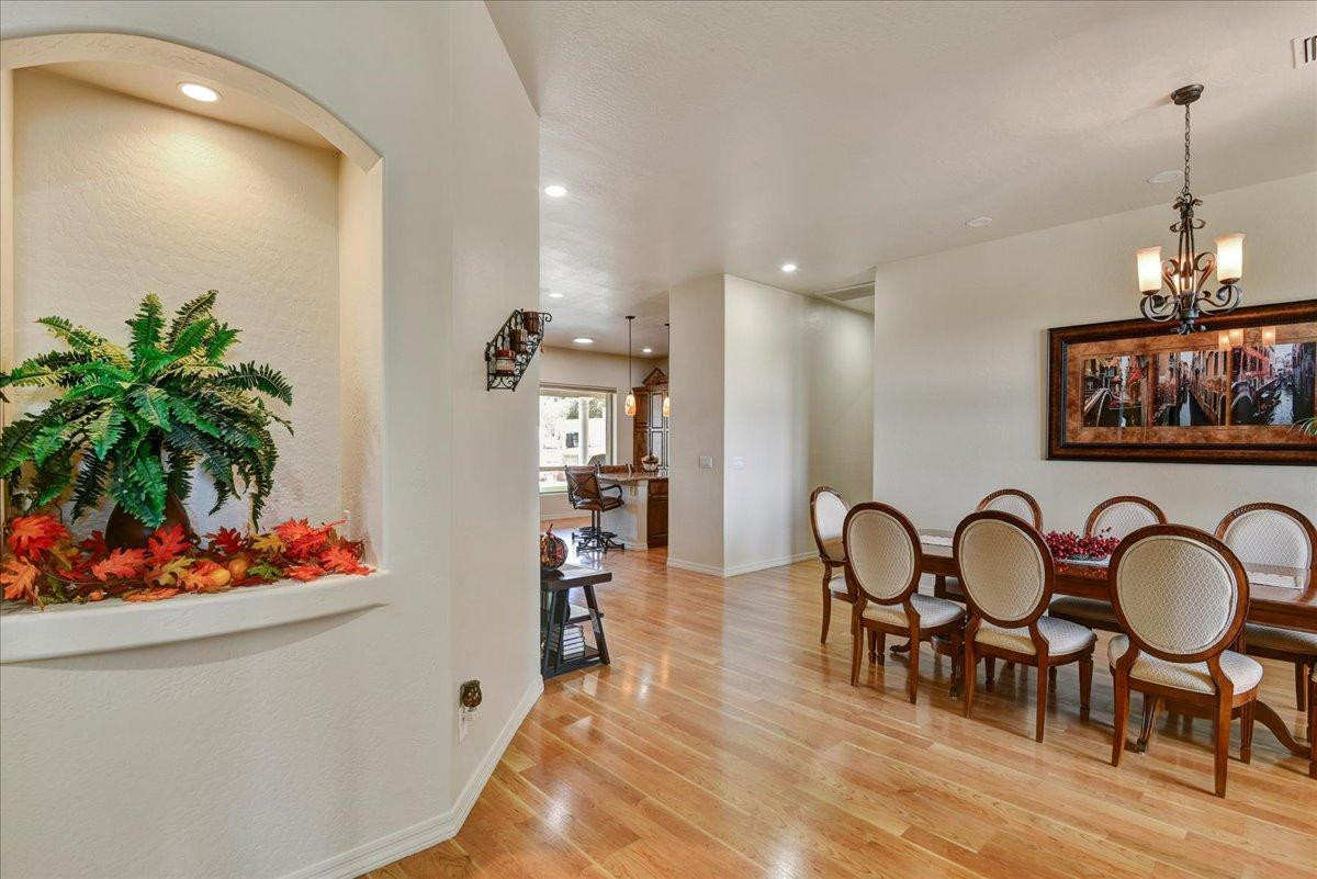 412 East Yearling Road Phoenix, AZ 85085 - Photo 7 of 51 a dining room with furniture and wooden floor
