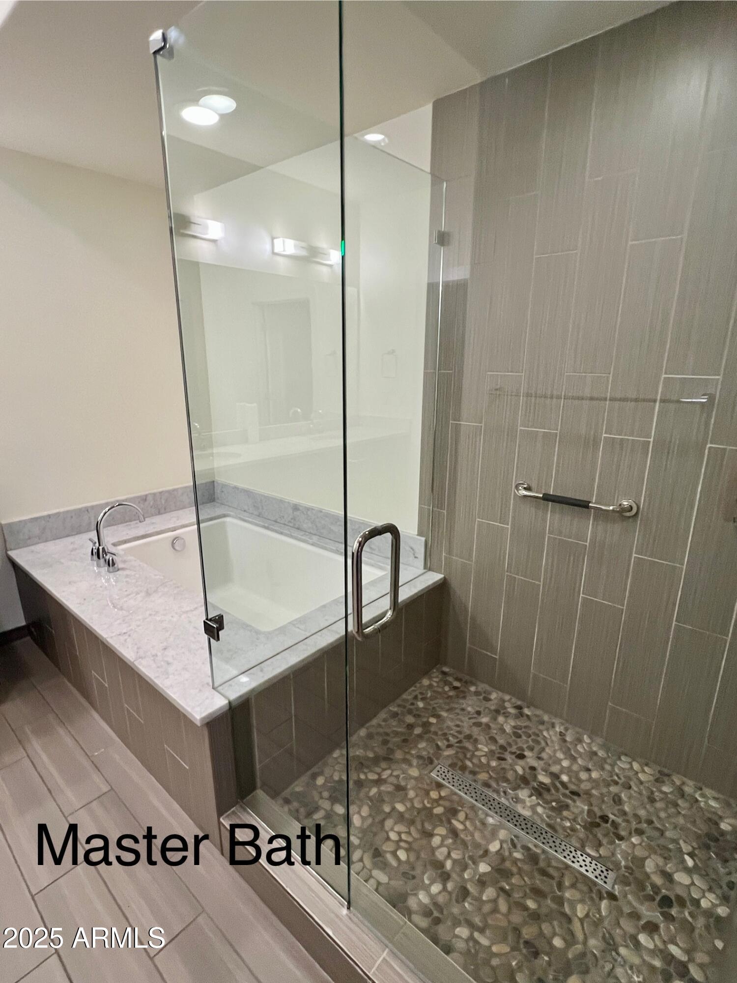 4803 North Woodmere Fairway, Unit 1004 Scottsdale, AZ 85251 - Photo 14 of 21 a bathroom with a shower and a sink