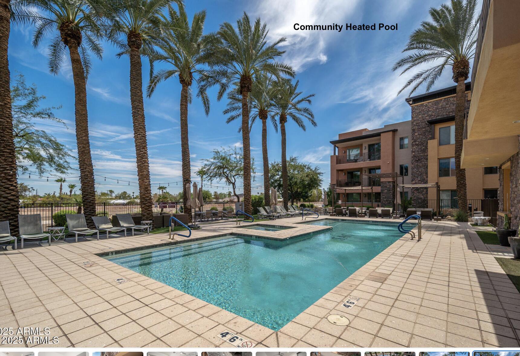 4803 North Woodmere Fairway, Unit 1004 Scottsdale, AZ 85251 - Photo 18 of 21 a view of swimming pool with outdoor seating and a lots of palm trees