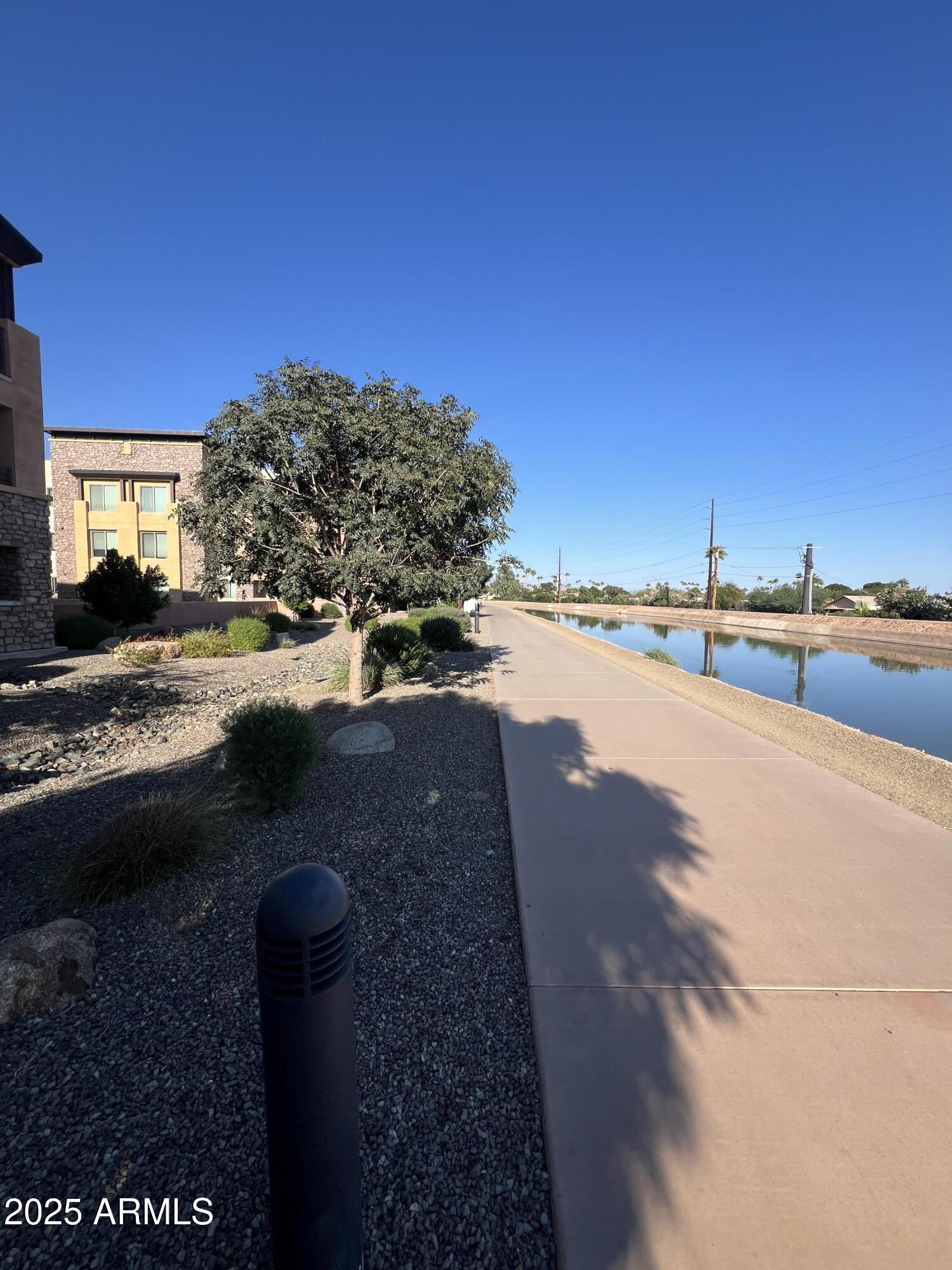 4803 North Woodmere Fairway, Unit 1004 Scottsdale, AZ 85251 - Photo 20 of 21 a view of a street with an ocean view