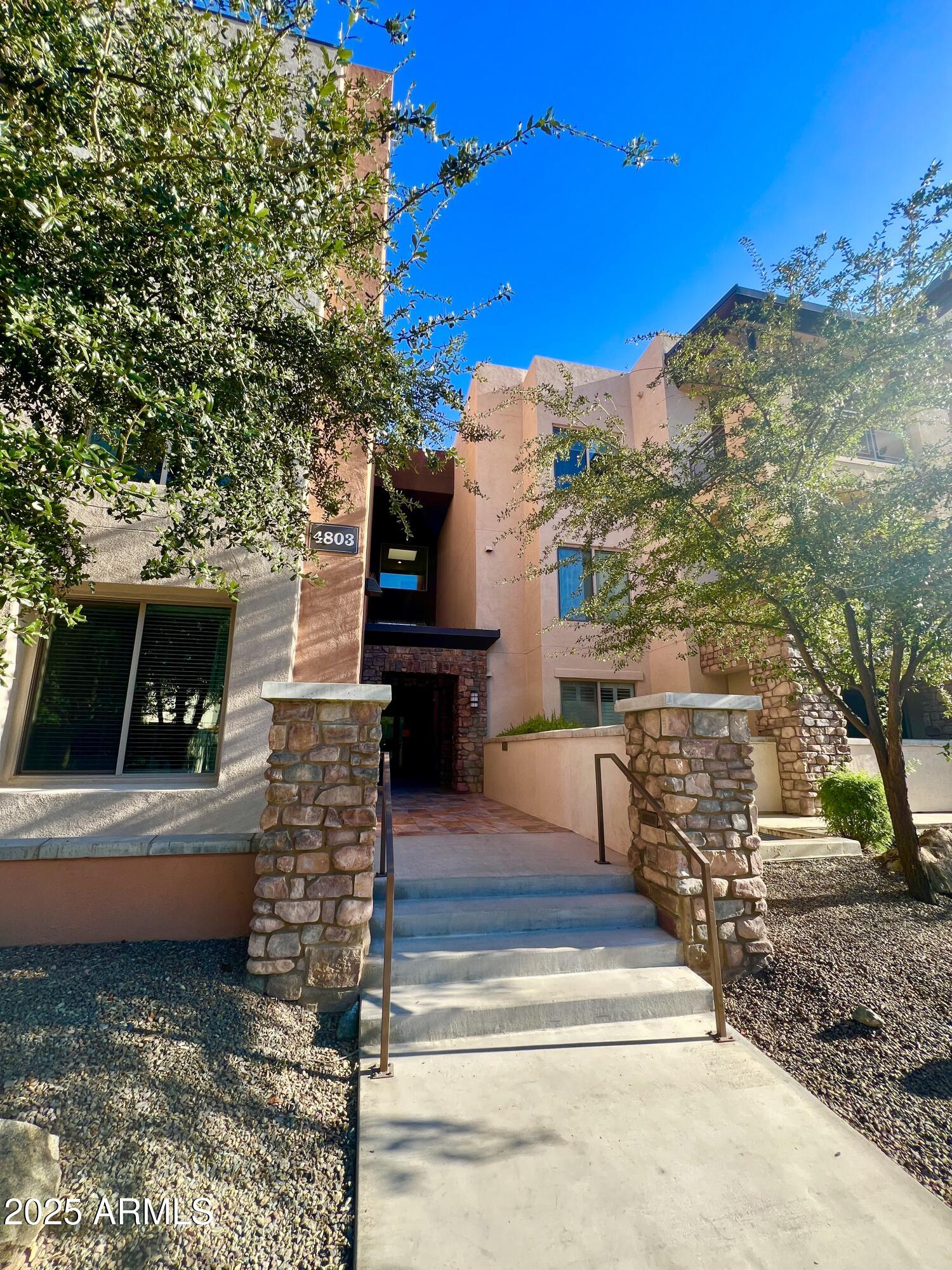 4803 North Woodmere Fairway, Unit 1004 Scottsdale, AZ 85251 - Photo 2 of 21 a view of a terrace with chairs