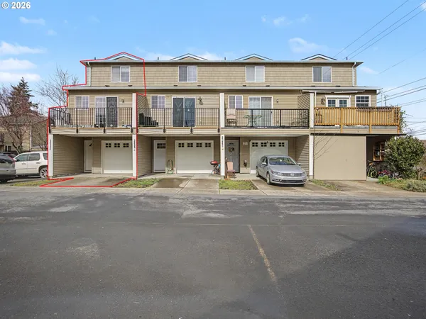 a front view of a building with garage