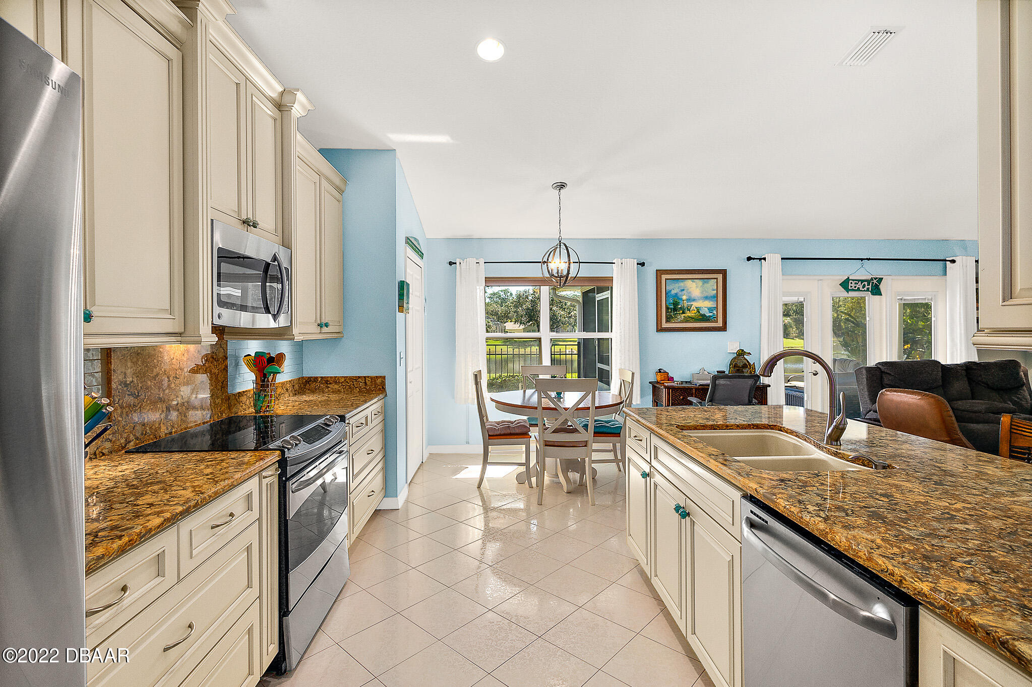 905 Brookridge Lane Ormond Beach, FL 32174 - Photo 12 of 47 Kitchen Opens Up to Breakfast Nook