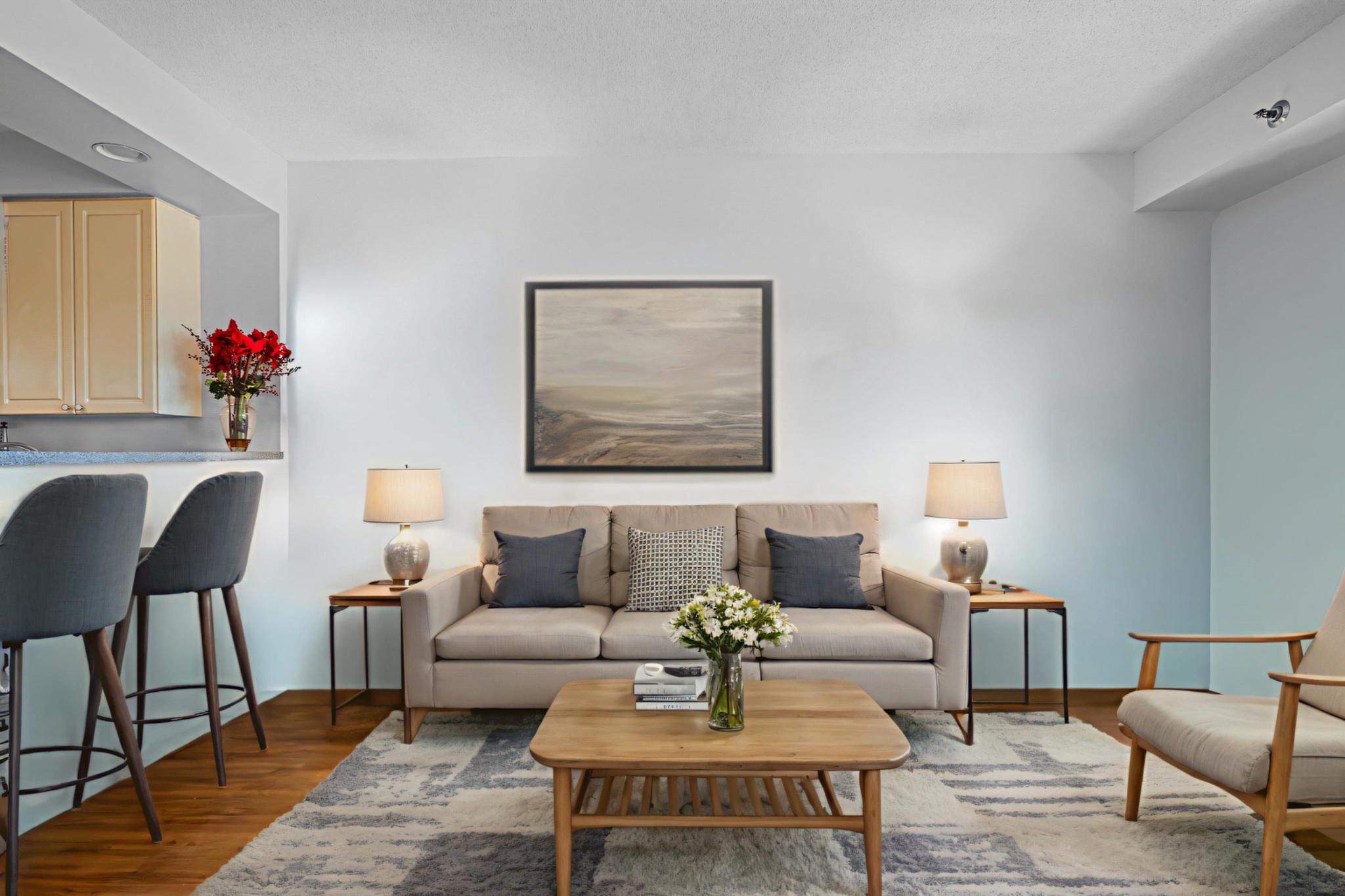 3005 South Leisure World Boulevard, Unit 702 Silver Spring, MD 20906 - Photo 1 of 43 a living room with furniture and a potted plant