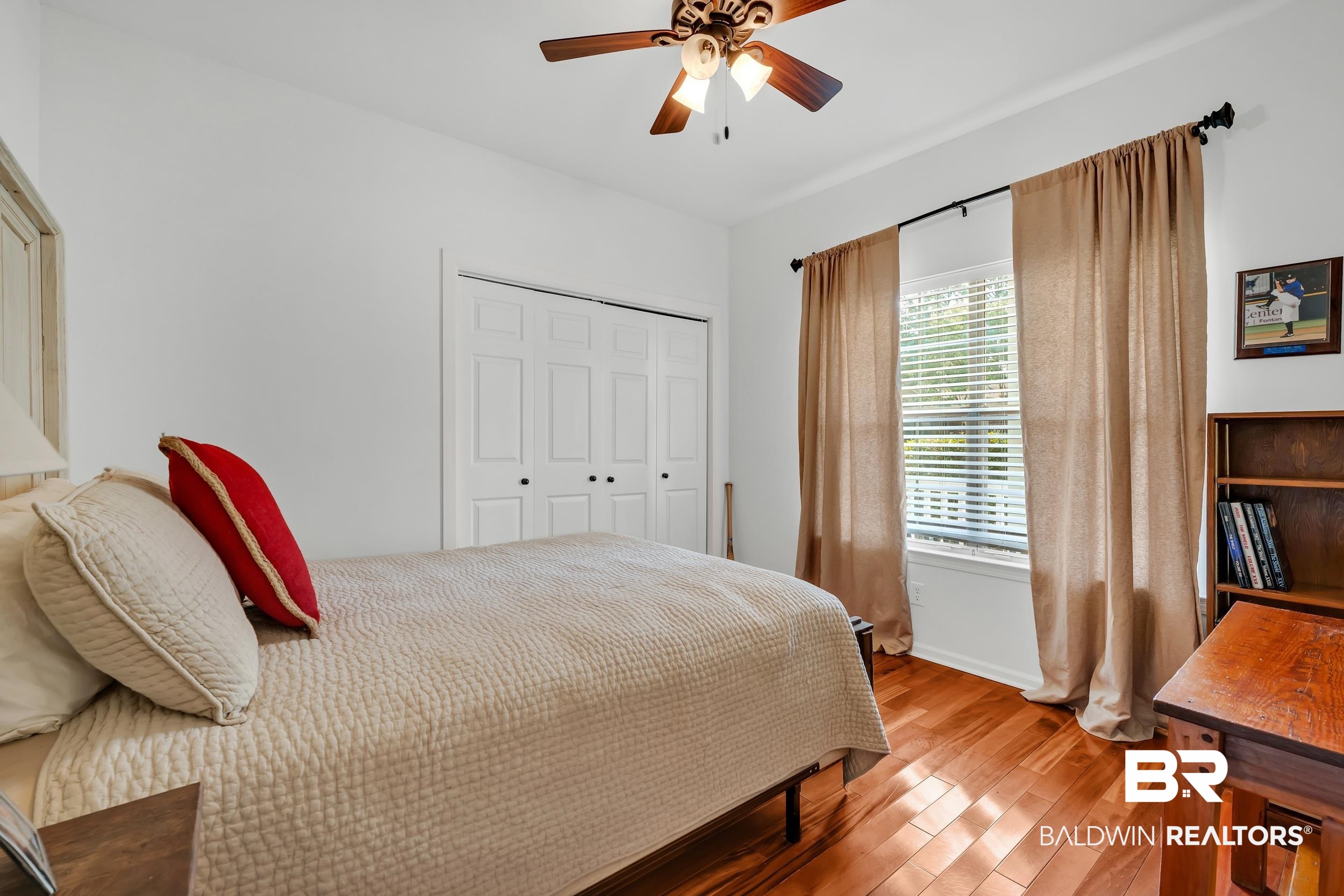 2 Navy Lane Daphne, AL 36527 - Photo 24 of 28 Bedroom featuring light wood-type flooring, a closet, and ceiling fan