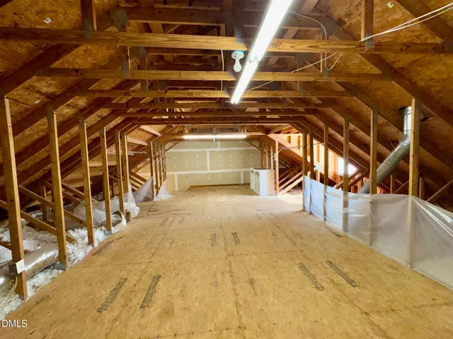 a view of a room with wooden stairs