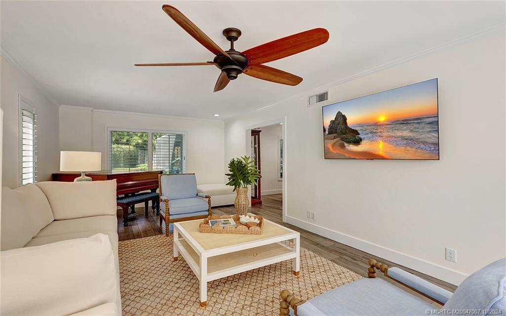 26 Rio Vista Drive Stuart, FL 34996 - Photo 12 of 58 a living room with furniture and a window