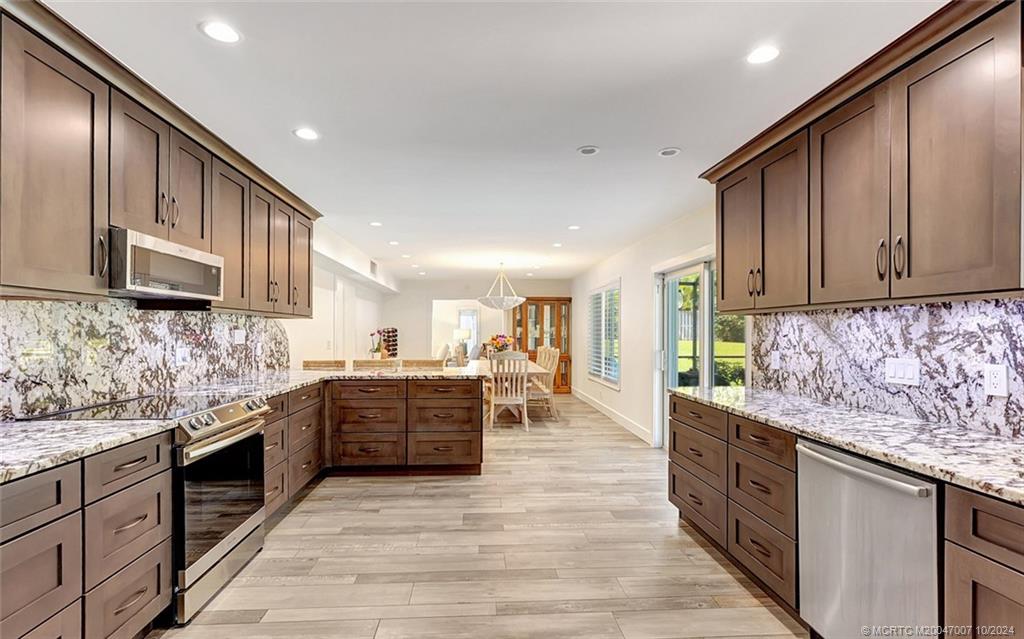 26 Rio Vista Drive Stuart, FL 34996 - Photo 21 of 58 a large kitchen with stainless steel appliances lots of counter top space