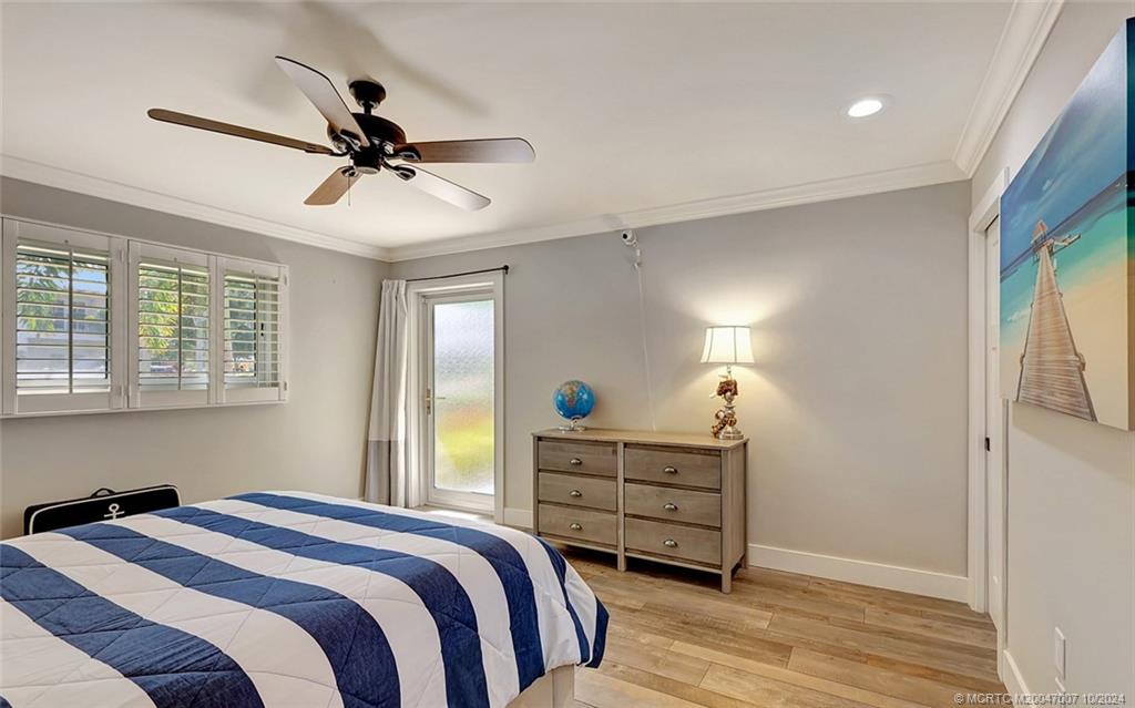 26 Rio Vista Drive Stuart, FL 34996 - Photo 24 of 58 a bedroom with a bed and a window
