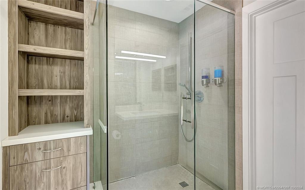 26 Rio Vista Drive Stuart, FL 34996 - Photo 28 of 58 a bathroom with a shower
