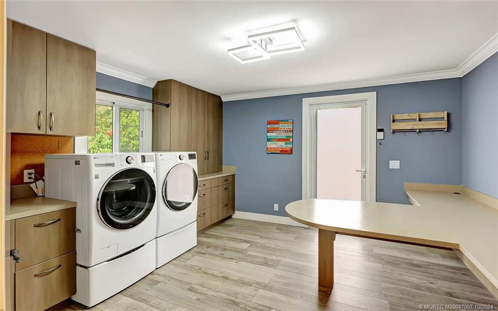 26 Rio Vista Drive Stuart, FL 34996 - Photo 47 of 58 a utility room with sink dryer and washer