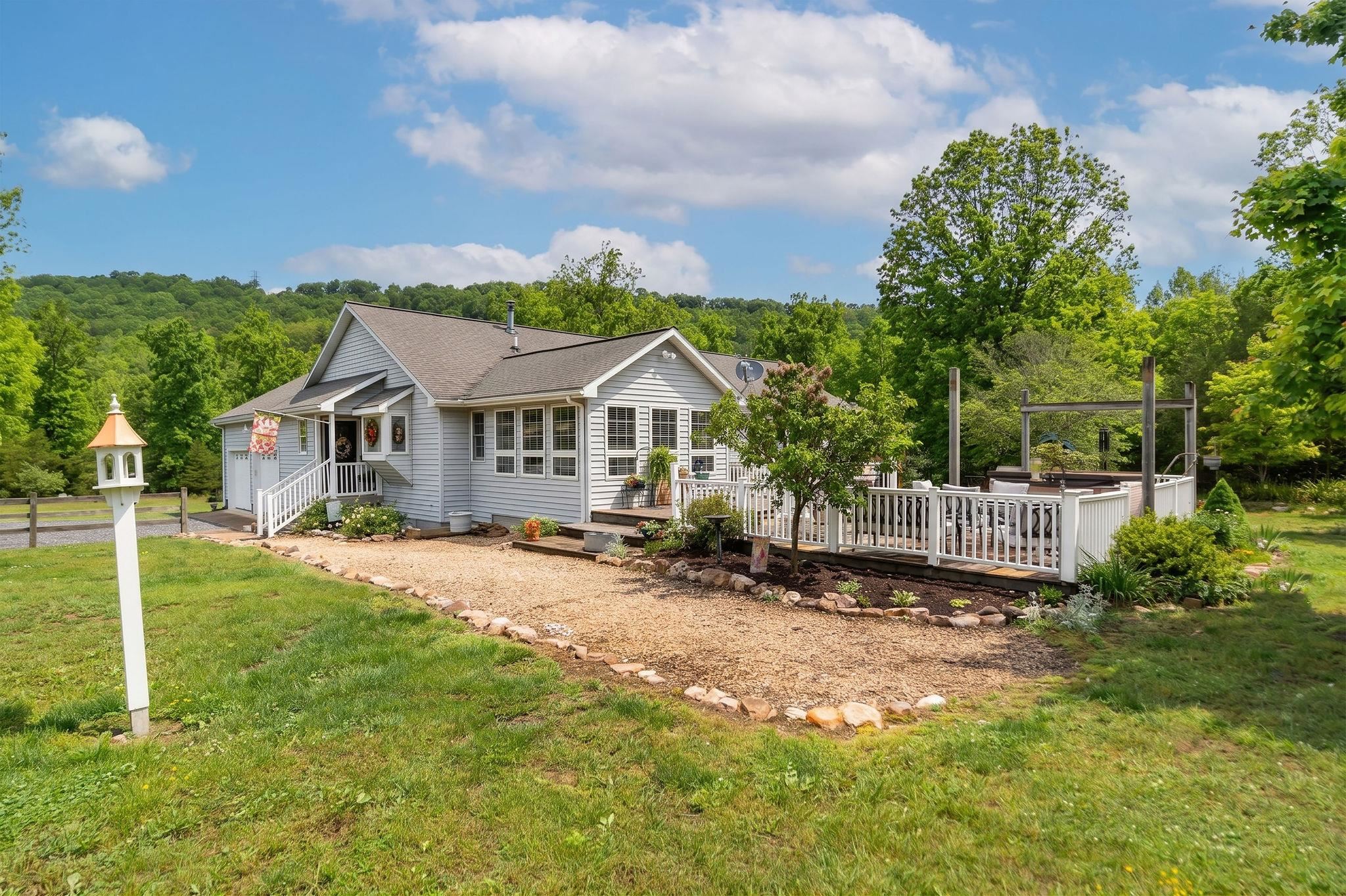 516 Estaline Valley Road Craigsville, VA 24430 - Photo 14 of 75 a view of a house with a yard and sitting area