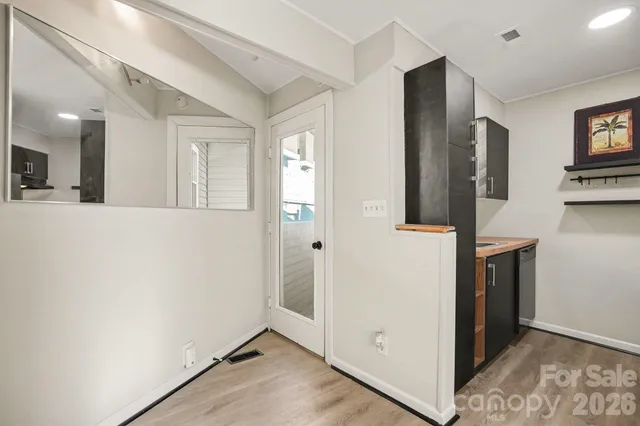 a view of empty room with windows