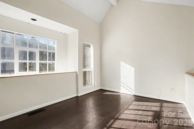 a bathroom with a shower toilet and a mirror