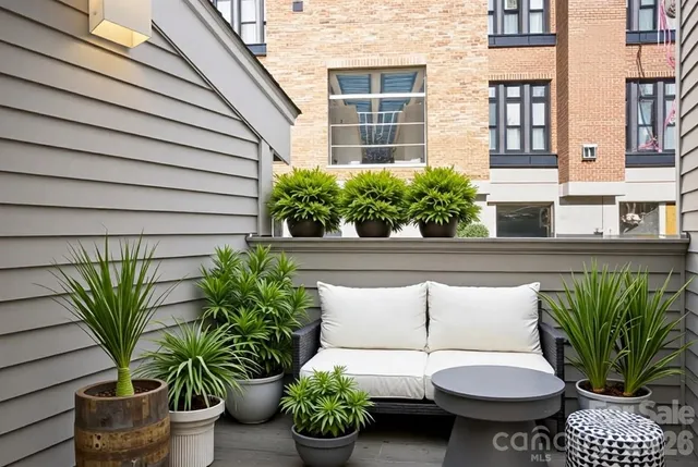 a white couch sitting in front of a building
