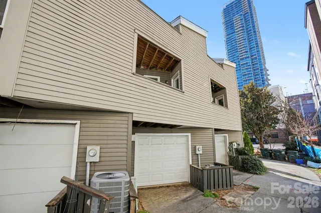 a view of a house with a tree