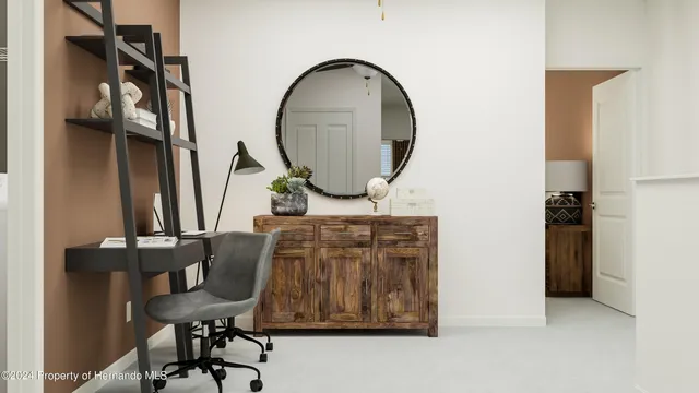 a bedroom with a bed and a lamp