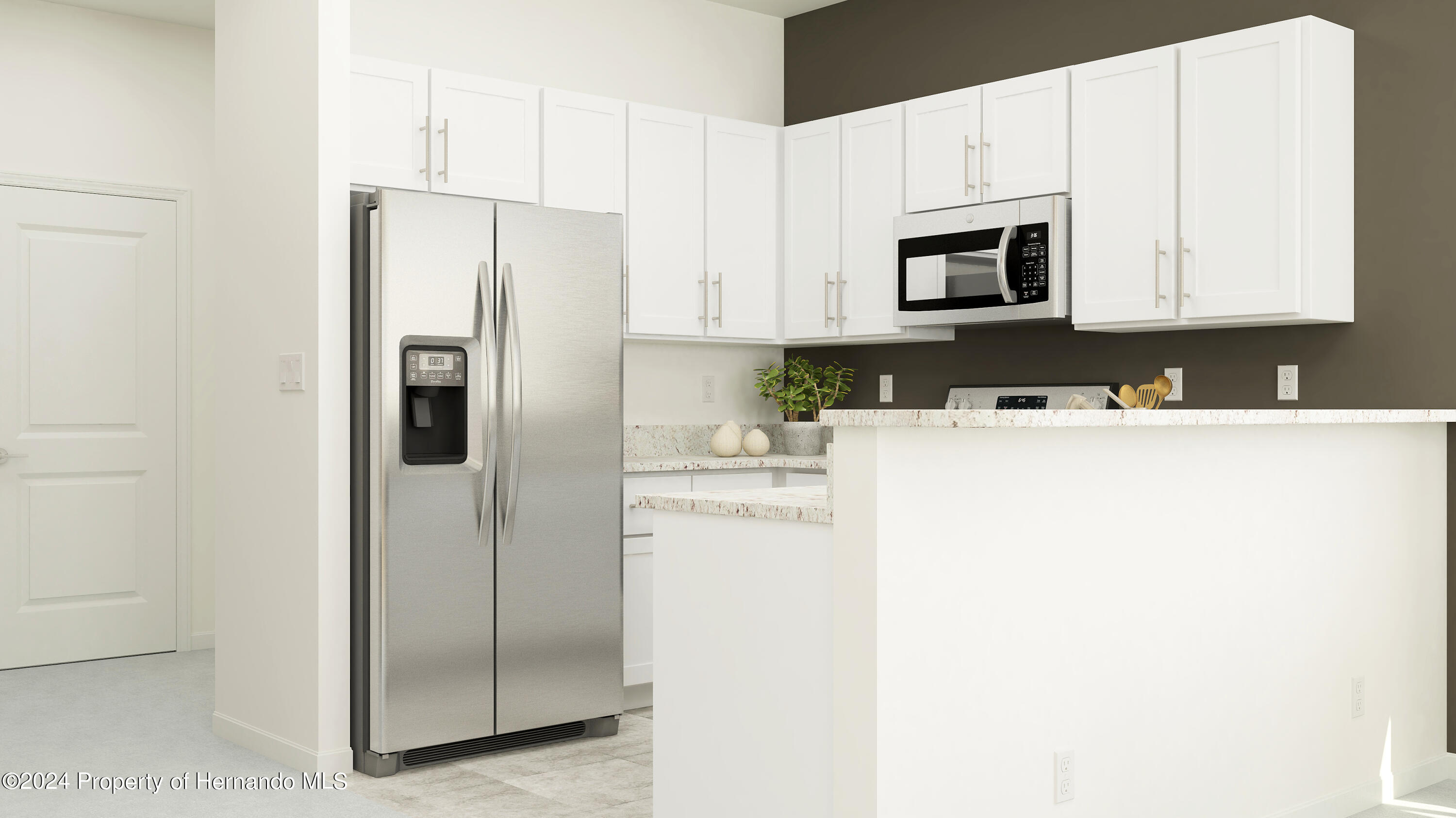 11095 Wishing Cloud Road Land O Lakes, FL 34638 - Photo 8 of 12 a kitchen with stainless steel appliances a refrigerator sink and microwave