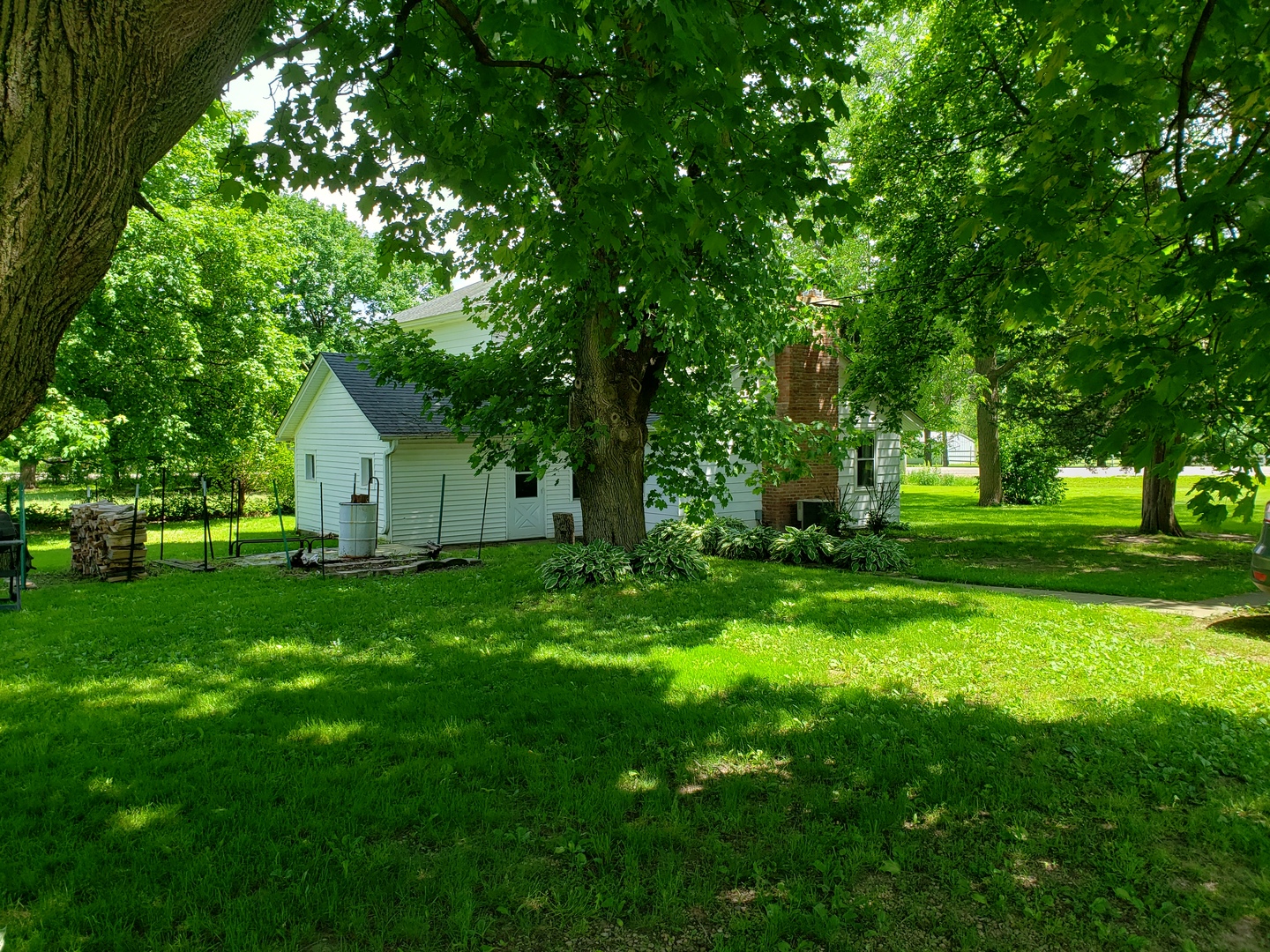 7120 A Tryon Grove Road Richmond, IL 60071 - Photo 2 of 23 a view of a house with backyard and garden
