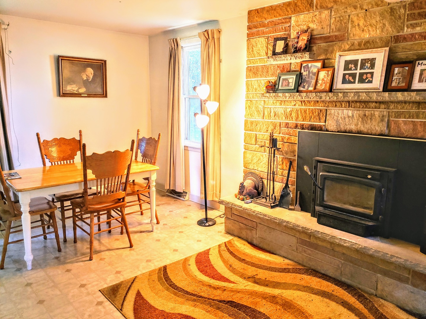 7120 A Tryon Grove Road Richmond, IL 60071 - Photo 11 of 23 a view of a livingroom with furniture a fireplace and wooden floor