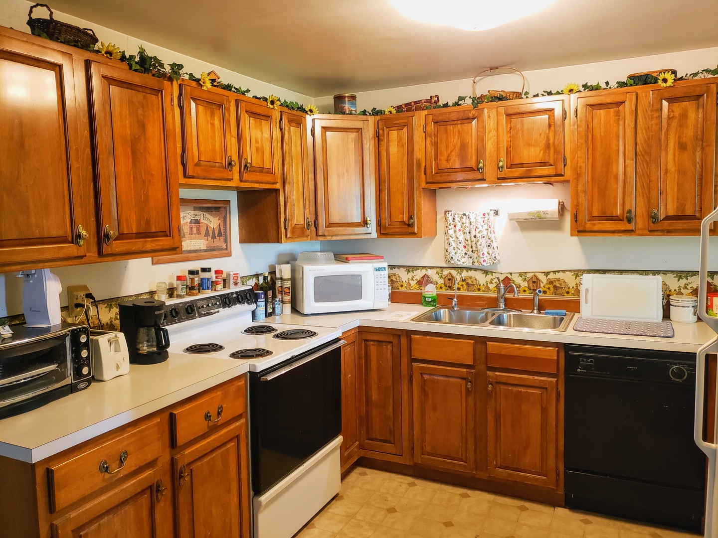 7120 A Tryon Grove Road Richmond, IL 60071 - Photo 8 of 23 a kitchen with a sink a stove and cabinets