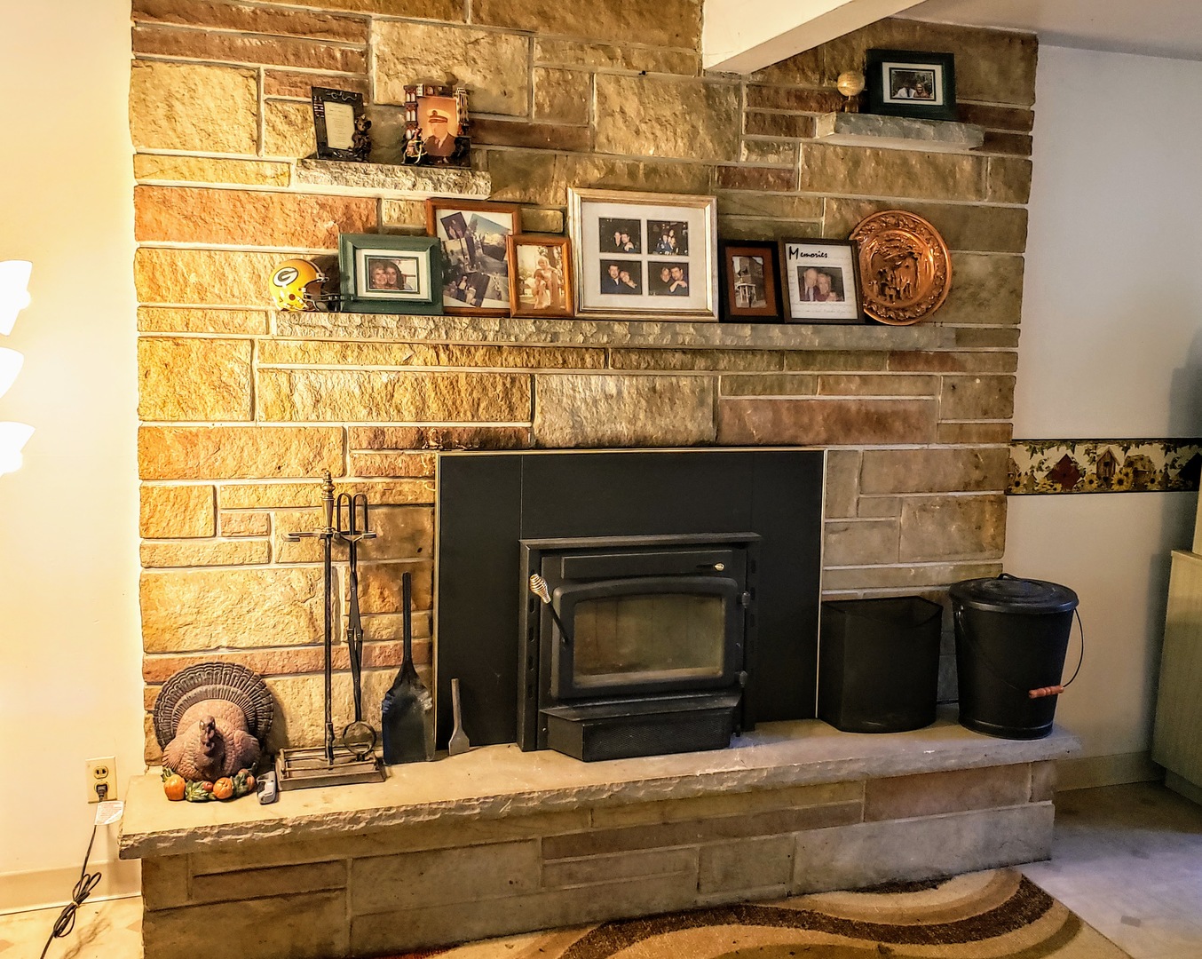 7120 A Tryon Grove Road Richmond, IL 60071 - Photo 10 of 23 a room with fireplace and mirror