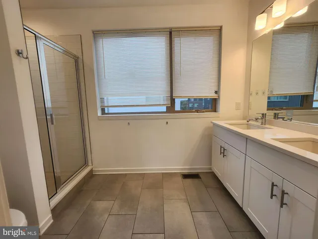 a bathroom with a sink a mirror and a bathtub